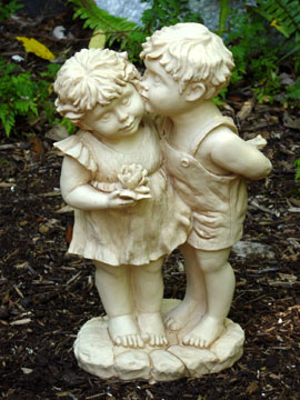 garden statue, boy and girl kissing